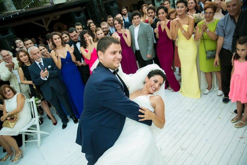 A pose from the dance of a bride and groom at their wedding reception.